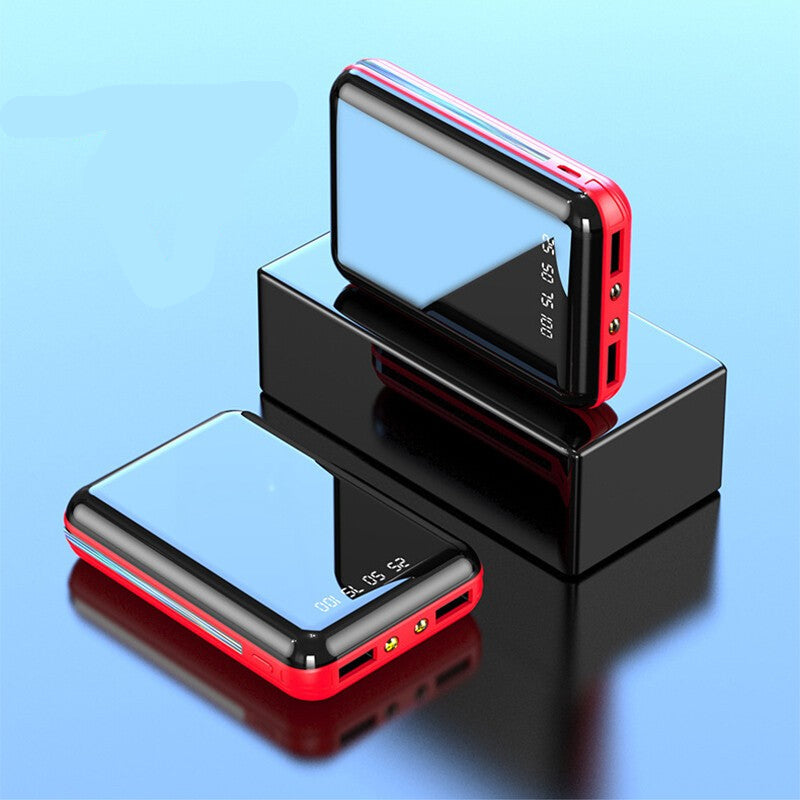 Two red and black electronic devices on a reflective surface with a blue background